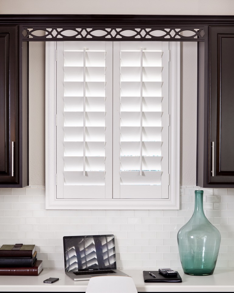 Shutters open by lifting a center tilt-rod -- no cords needed. Shutters in kitchen